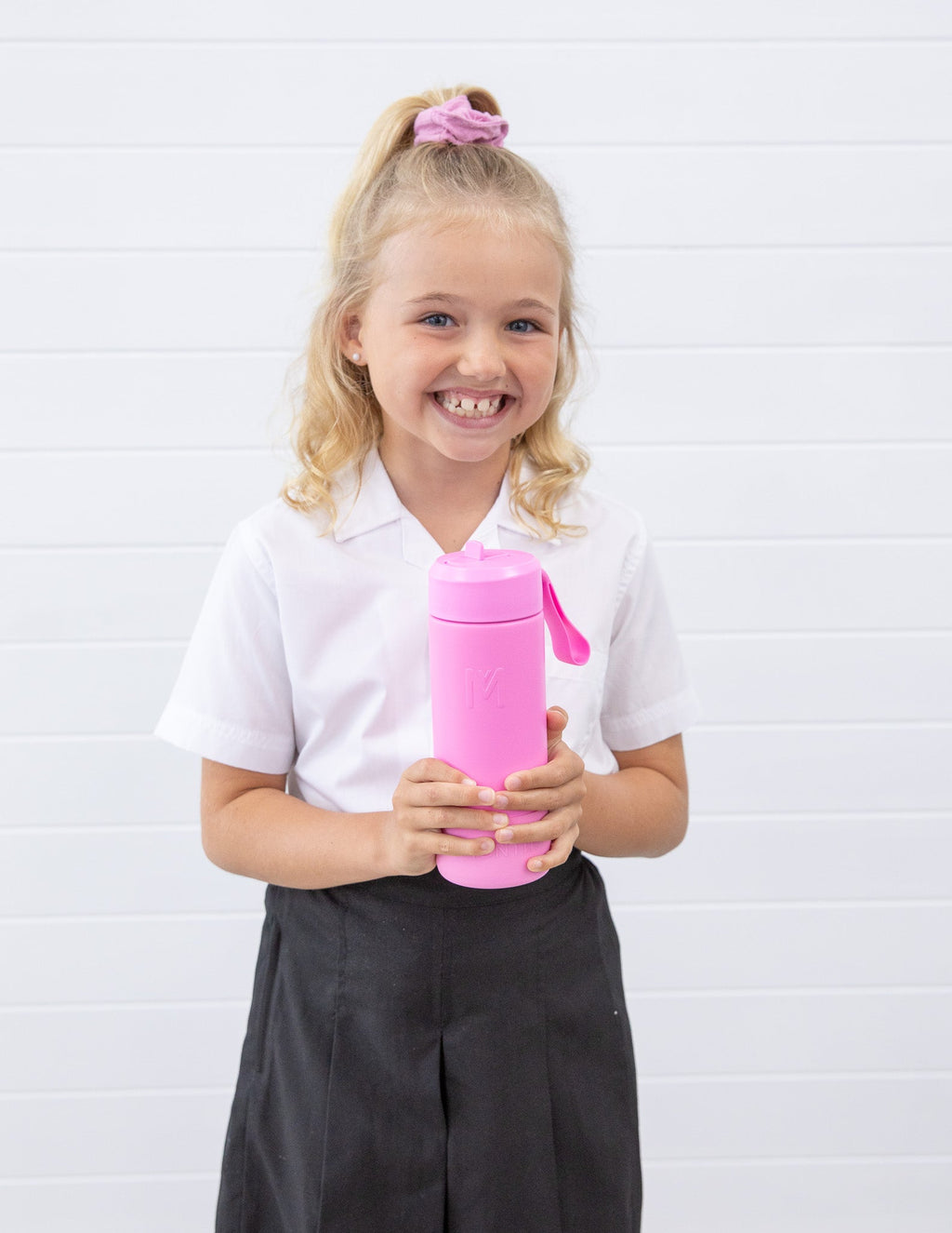 Child holding MontiiCo 475ml Fusion Drink Bottle Sipper - Floss